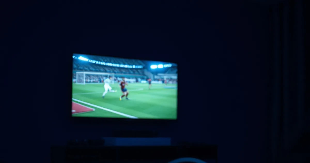 Dunkles Wohnzimmer nachts mit TV-Glanz und einem sichtbar verlegten Ethernet-Kabel zum Streaming-Gerät als Symbol für stabile IPTV-Internetgeschwindigkeit